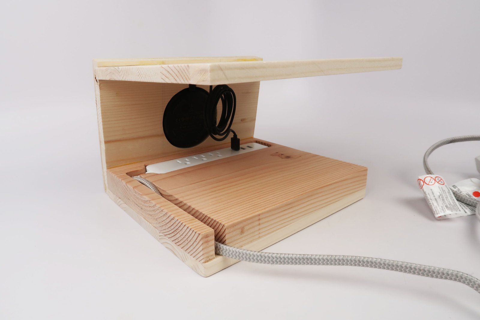 Hidden power strip and cable compartment